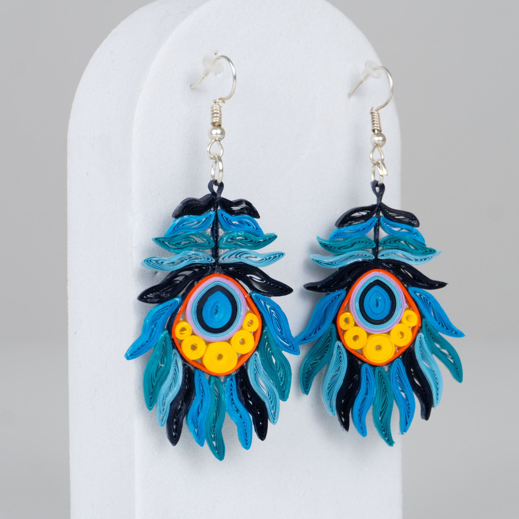 Aretes Plumas Azules Rollito