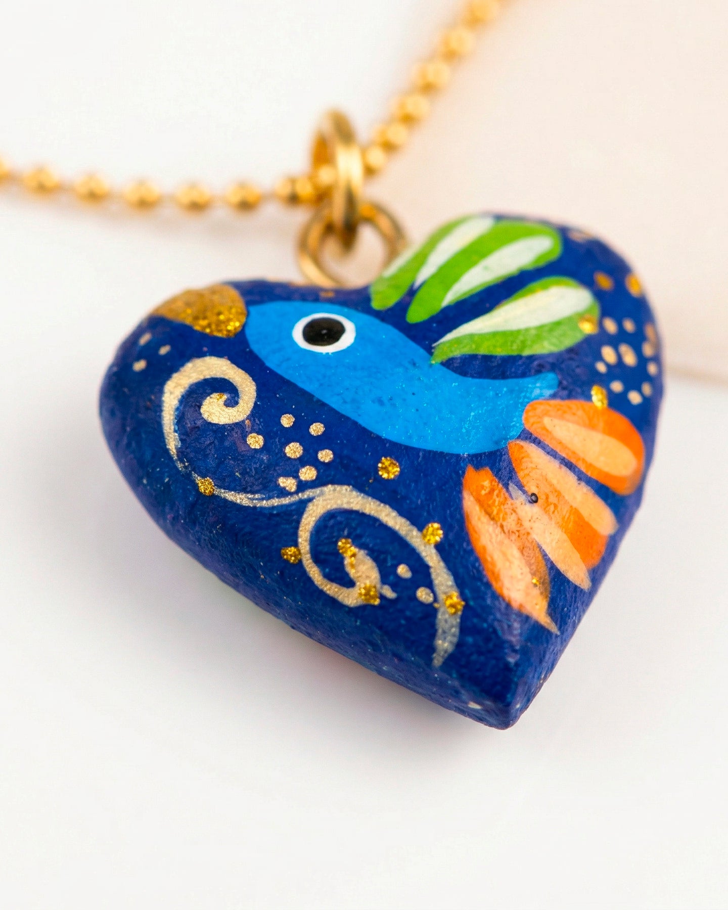 DIJE CORAZON MADERA Y CADENA CHAPA MU UT